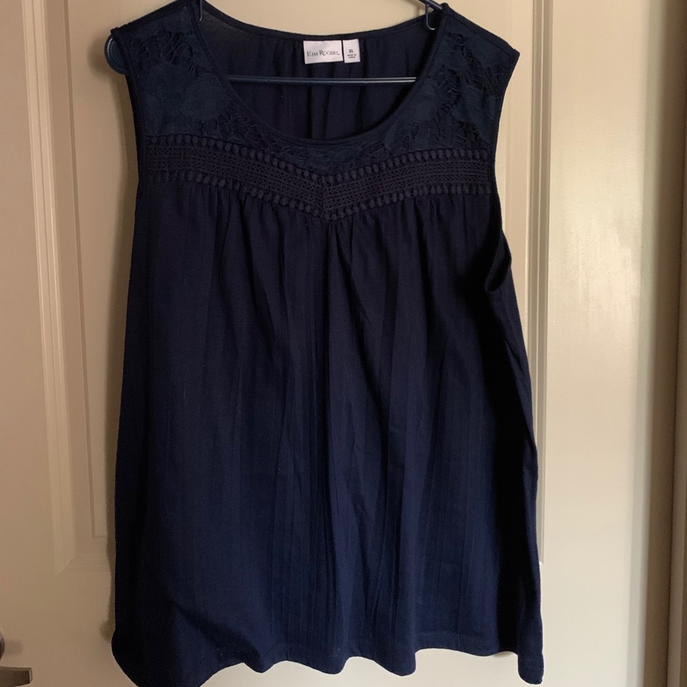 Sleeveless navy blouse with neckline detailing